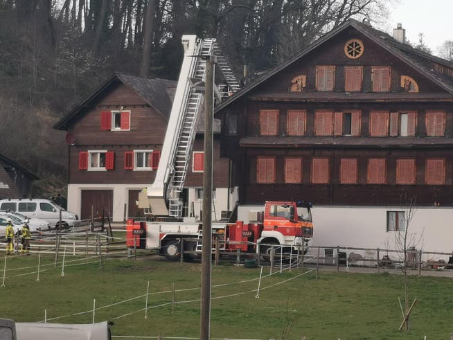 Using a turntable ladder, the fire department accessed the roof of the house via a hatch.